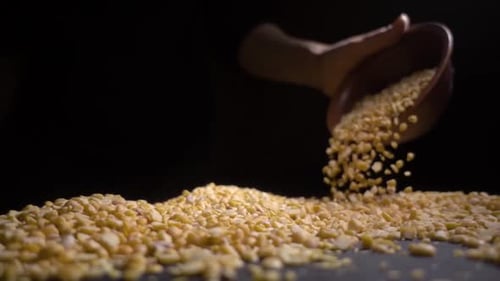 Split Mung Beans Pouring from Bowl