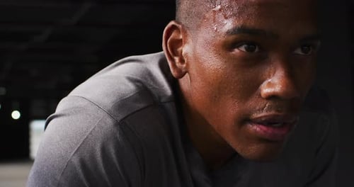 Portrait of african american man taking a break and breathing heavily