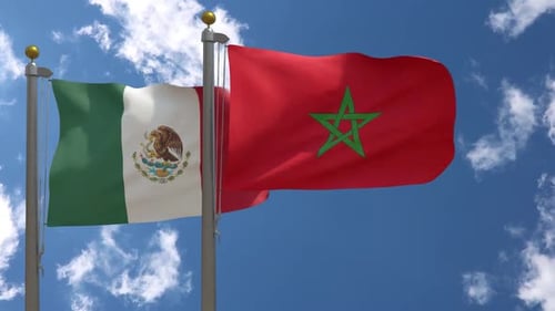 Mexico and Morocco National Flags Waving Against Blue Sky