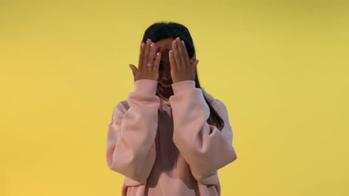 Smiling Brunette Young Adult Posing in Pink Hoodie