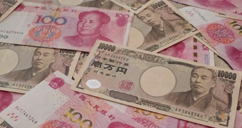 Chinese Renminbi and Japanese Yen Banknotes Close Up