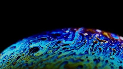 Multicolored Rainbow Colors of a Single Soap Bubble That Looks Like a Fantasy Planet Isolated