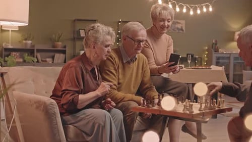 Seniors Enjoying Chess Game in Cozy Living Room