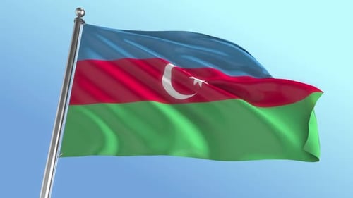 Realistic Waving Flag of Azerbaijan Against Blue Sky