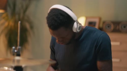 Black Musician Playing Favorite Song on Drums