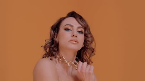 Glamorous Model Posing with Chunky Gold Chain