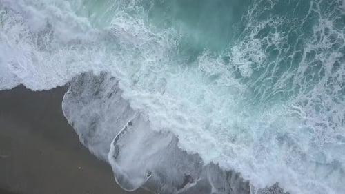 Aerial Top Down View of Turquoise Sea Waves Foaming and Splashing, Big Waves From Above Rolling