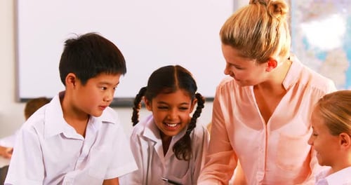 Teacher Using Tablet with Diverse Elementary School Students
