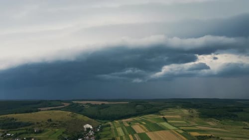Landscape of Dark Clouds Forming on Stormy Sky During Thunderstorm Over Rural Area