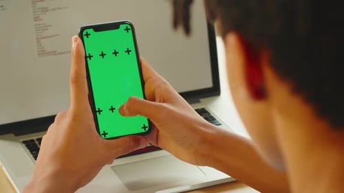 African American Man Using Smartphone with Chroma Key Closeup