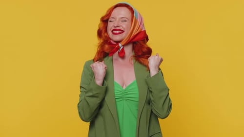 Woman with Red Hair Dancing in Green Outfit