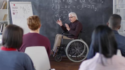 Professor in Wheelchair Giving a Lecture to Students