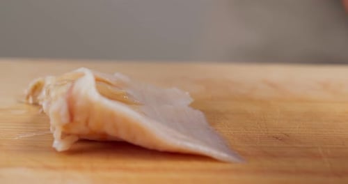 Ingredient Preparation on a Wooden Cutting Board