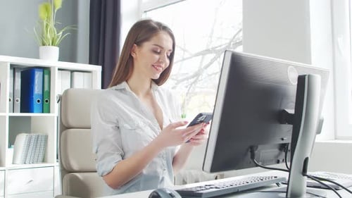Young Woman Works at Home Office Using Computer.