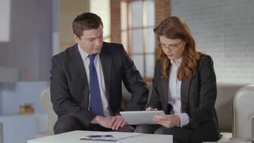 Female Employee Presenting Report on Tablet to Boss, Slow Motion