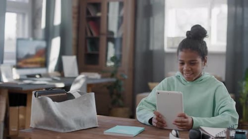 Afro Girl Using Tablet At Home