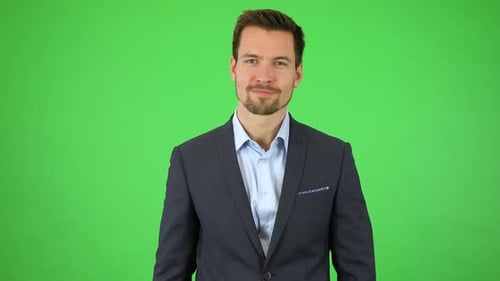 Man Gesturing With Digital Interface on Green Screen