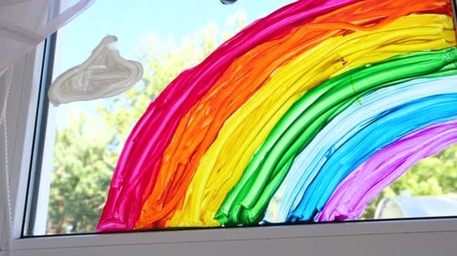 Child's Rainbow Painting on a Window