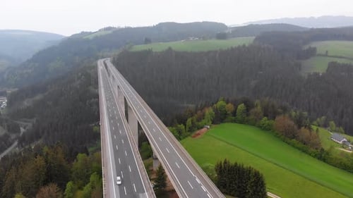 Aerial View of the Highway Viaduct on Concrete Pillars in the Mountains