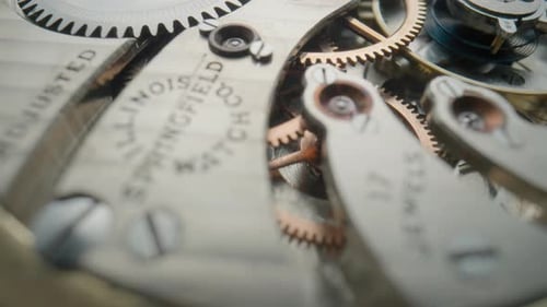 Clock Mechanism Gears Turning in Intricate Timepiece