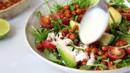 Fresh Salad Preparation with Avocado and Roasted Chickpeas