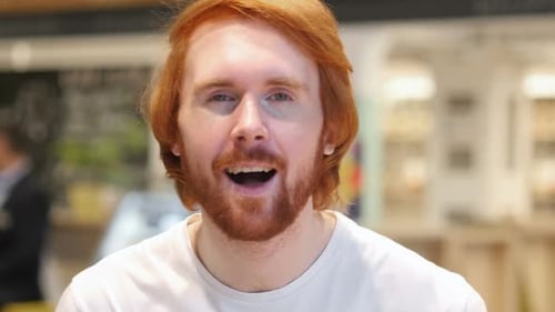 Positive Excited Redhead Man Pointing at Camera in Cafe Thumbs Up