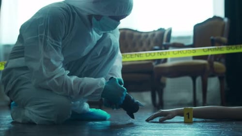 Forensic Investigator Examining Evidence at Crime Scene