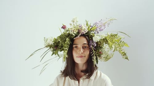 Woman With Flower Crown Smiling at the Camera