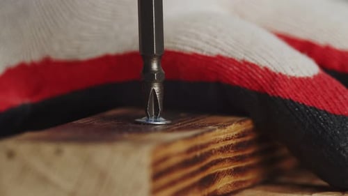 Screw Being Drilled into Block of Wood