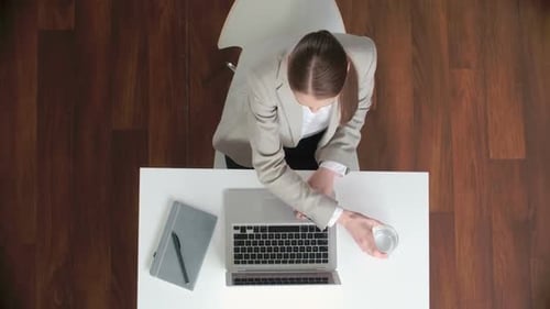 Business Lady Working on Laptop