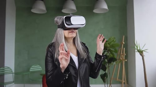 Woman with Gray Hair Wearing VR Headset