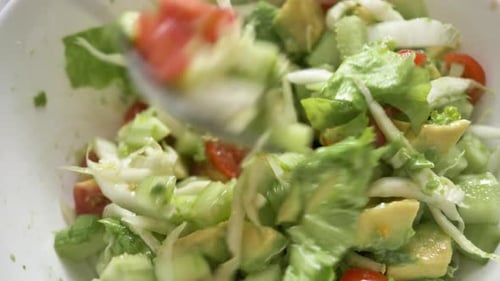 Mixing a Fresh and Healthy Green Salad
