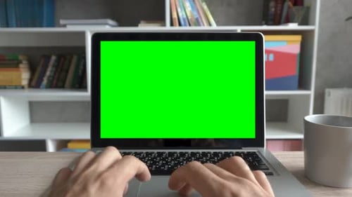 Hands Typing on Laptop Keyboard With Green Screen