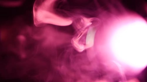 Moving Wisps of Pink Smoke with Bright Light