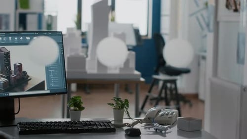 Leerer architektonischer Arbeitsplatz mit Gebäudemodell und 3D-Konstruktionslayout auf dem Tisch