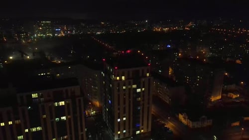 Flight Over the Night City and the House That Glows at Night