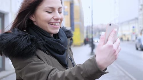 Online Video Chat on Smartphone By Woman on Street