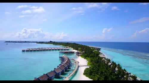Aerial drone shot travel of exotic tourist beach break by shallow lagoon and clean sand background o