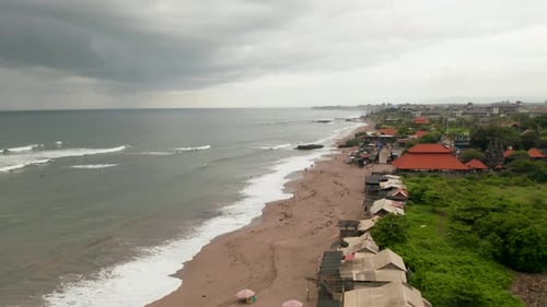 People on the Sand Beach in Canggu Bali During Rain Season