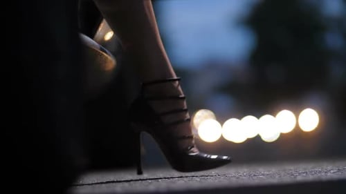Woman in Black High Heels Standing by Car