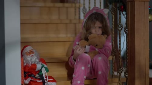 Sad Girl Hugs Teddy Bear on Stairs at Christmas