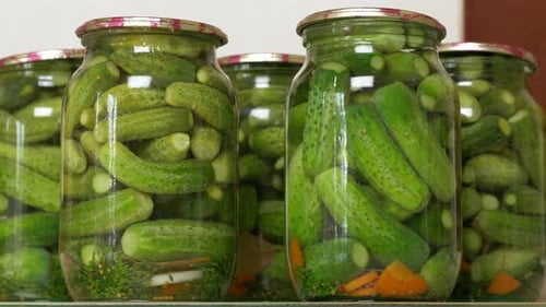 Pickled Cucumbers in Glass Jars for Food Preservation