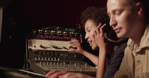 Singer and Pianist Working in Studio