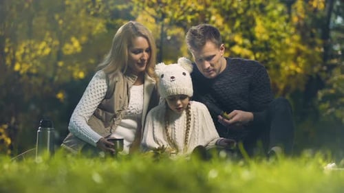 Family Having Fun on Picnic in Autumn Forest