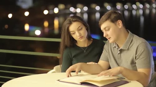 A Romantic Couple Having Fun in a Cafe in Love with Valentine's Day