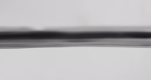 Water Surface Rising and Falling against White Background