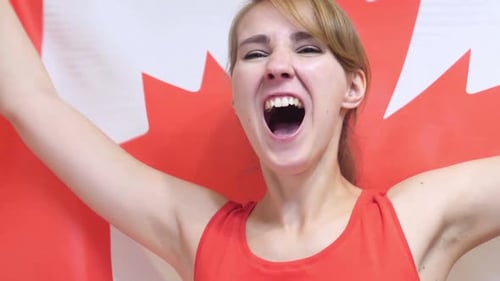 Woman Cheers with Canadian Flag
