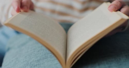 Close up of Book Pages Held Open