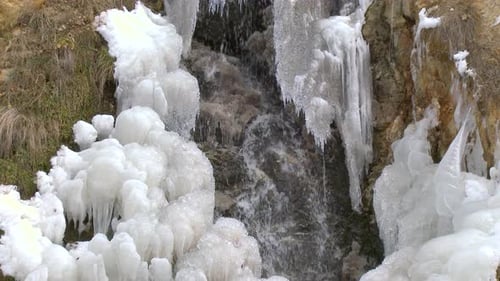 Frozen Waterfall with Icy Textures in Winter