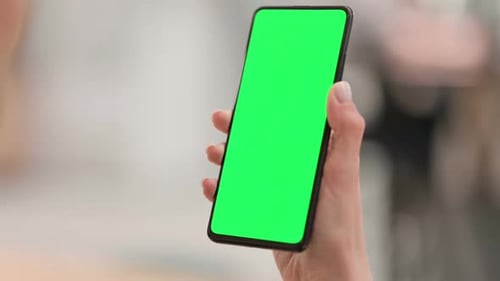 Female Hands Using Smartphone with Green Chroma Key Screen